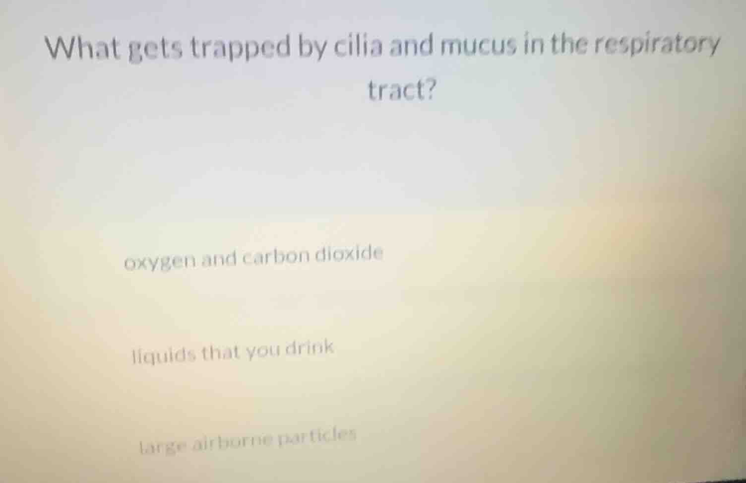 what gets trapped by cilia and mucus in the respiratory tract? oxygen a…