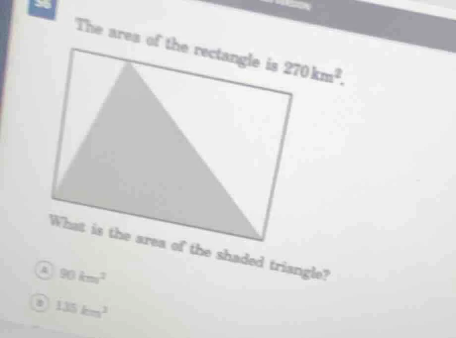 the area of the rectangle is 270 km². what is the area of the shaded tr…
