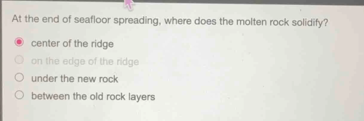 at the end of seafloor spreading, where does the molten rock solidify? …