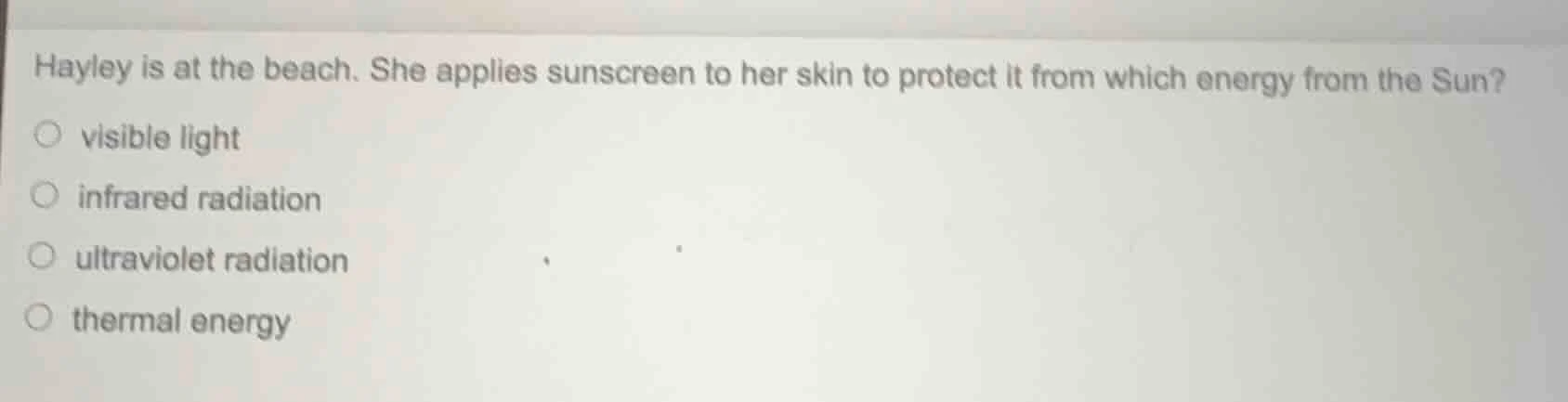 hayley is at the beach. she applies sunscreen to her skin to protect it…