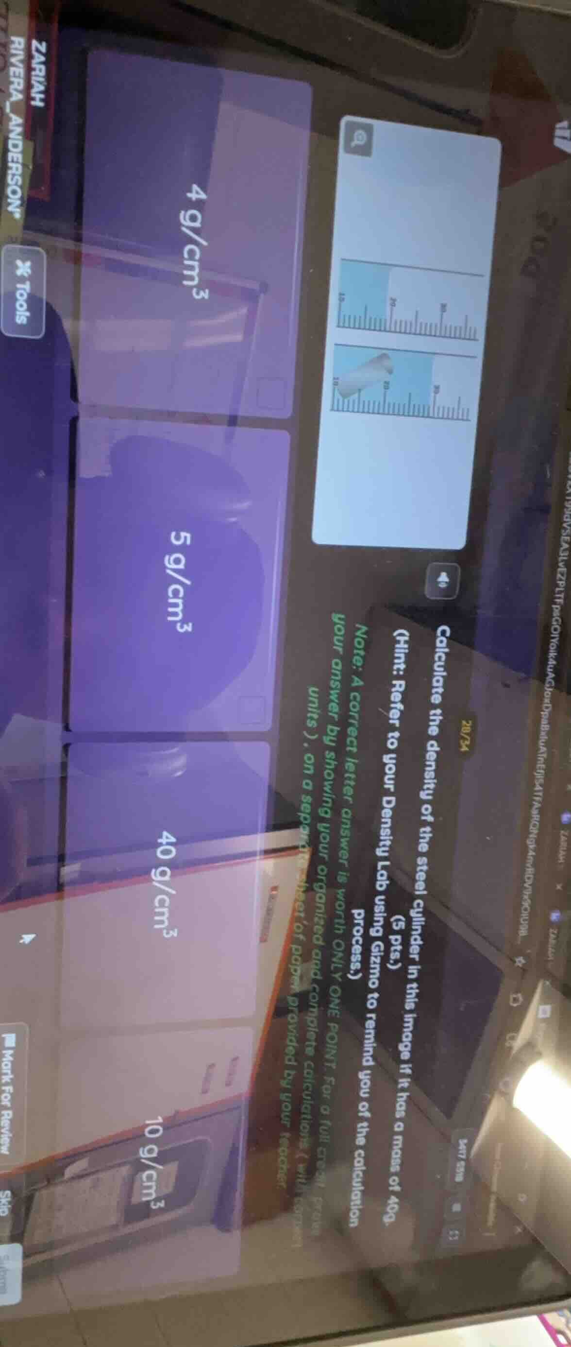 calculate the density of the steel cylinder in this image if it has a m…