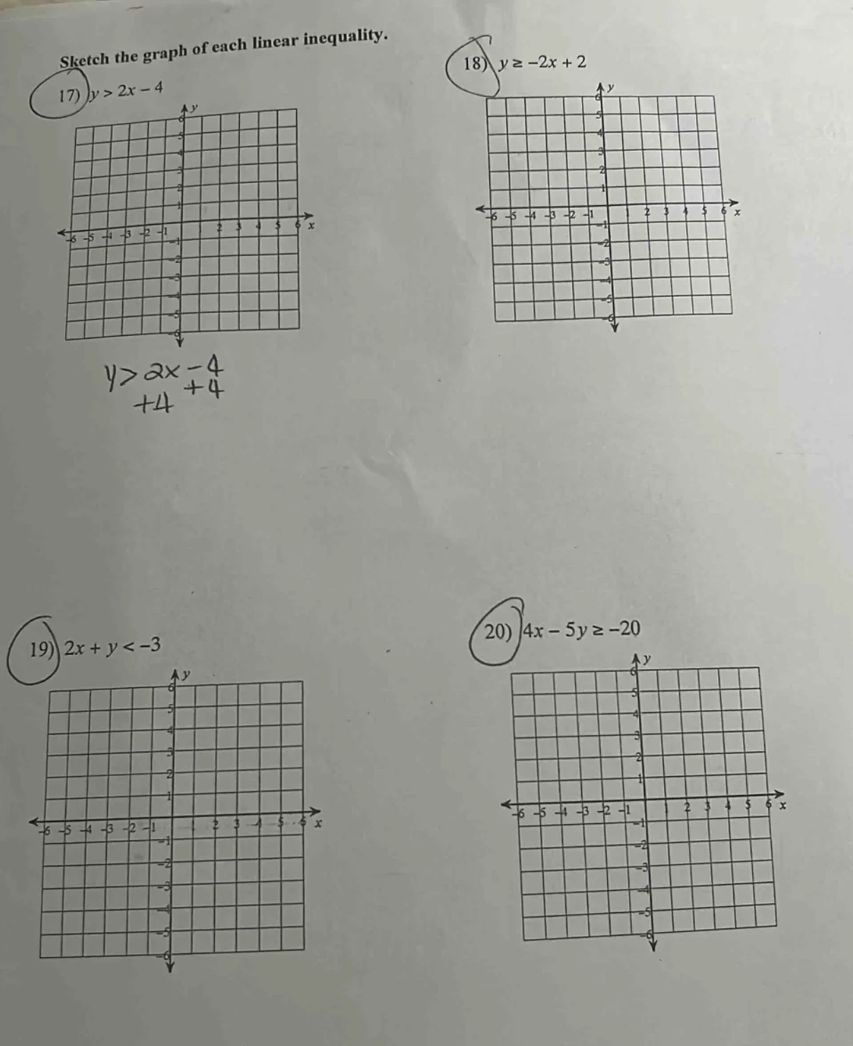 sketch the graph of each linear inequality. 17) $y > 2x - 4$ 18) $y \\g…