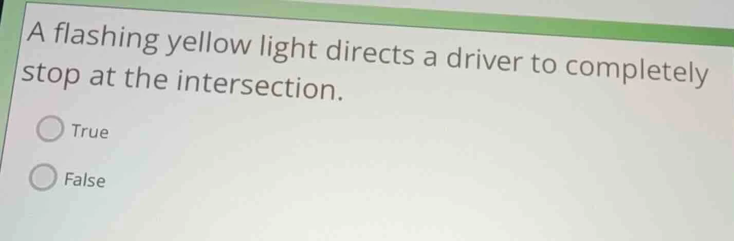 a flashing yellow light directs a driver to completely stop at the inte…