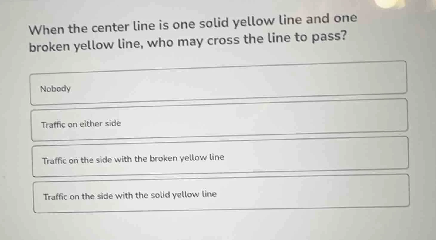 when the center line is one solid yellow line and one broken yellow lin…