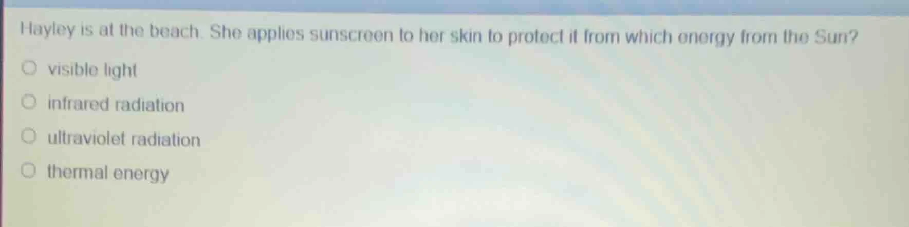 hayley is at the beach. she applies sunscreen to her skin to protect it…