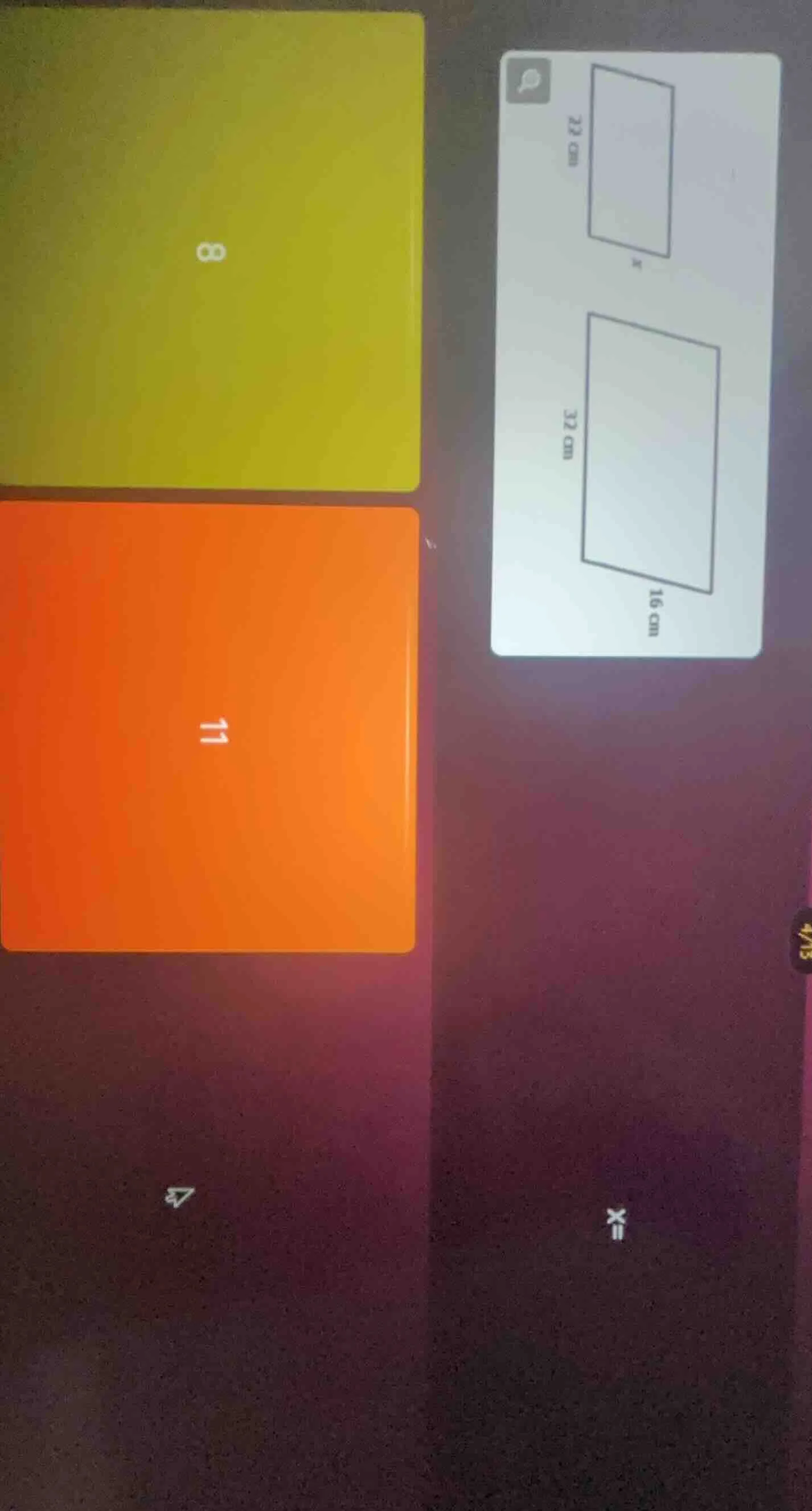 there are two rectangles. the first rectangle has a side of 22 cm and t…