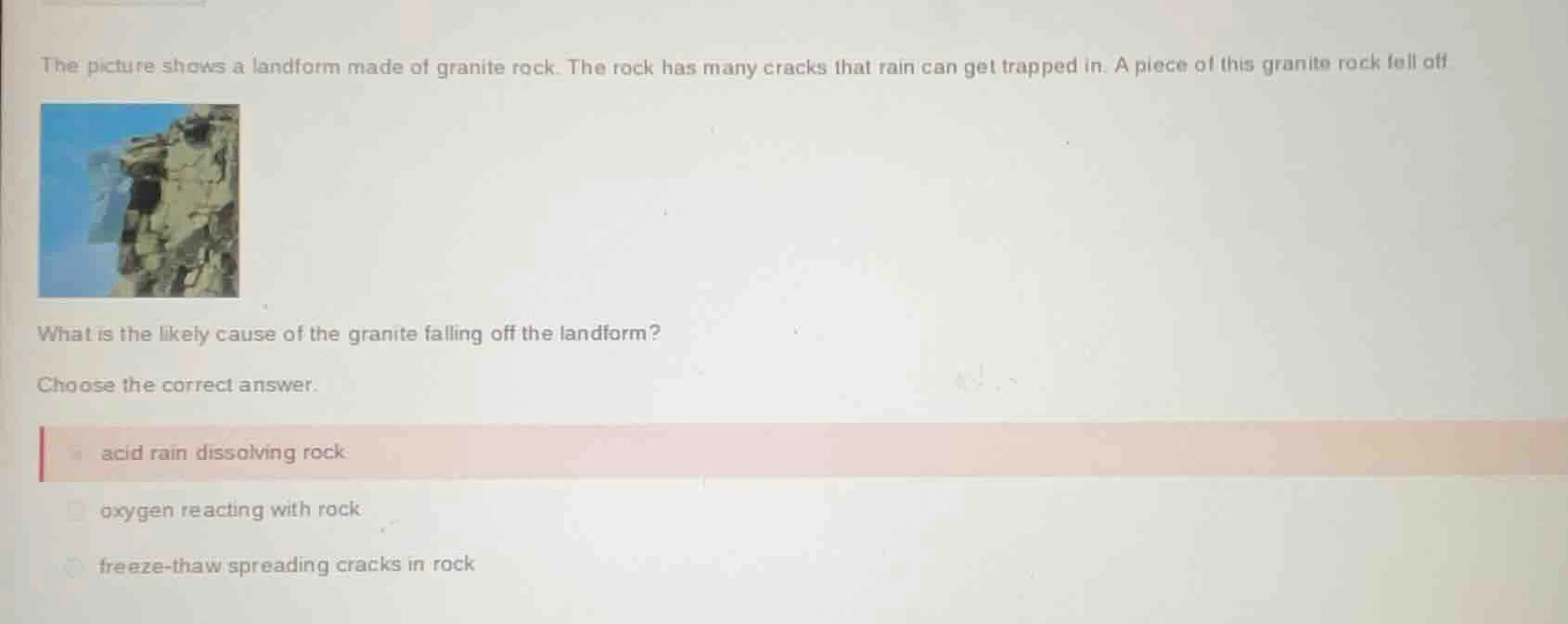 the picture shows a landform made of granite rock. the rock has many cr…