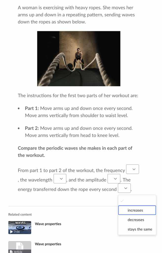 a woman is exercising with heavy ropes. she moves her arms up and down …