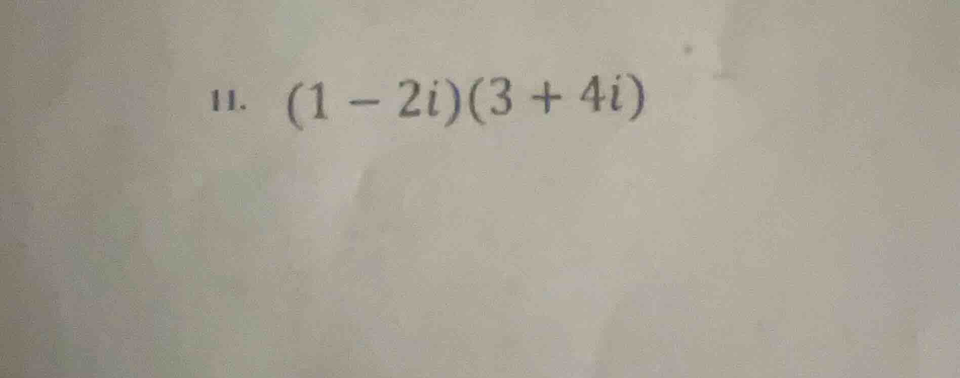 11. (1 - 2i)(3 + 4i)