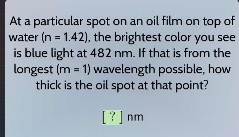 at a particular spot on an oil film on top of water (n = 1.42), the bri…