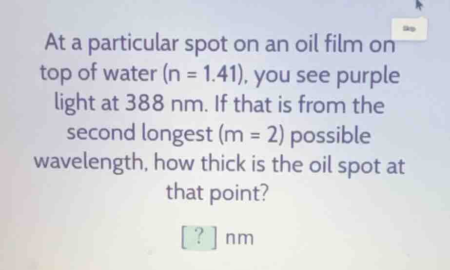 at a particular spot on an oil film on top of water (n = 1.41), you see…