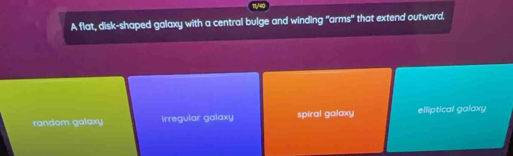 a flat, disk - shaped galaxy with a central bulge and winding \arms\ th…