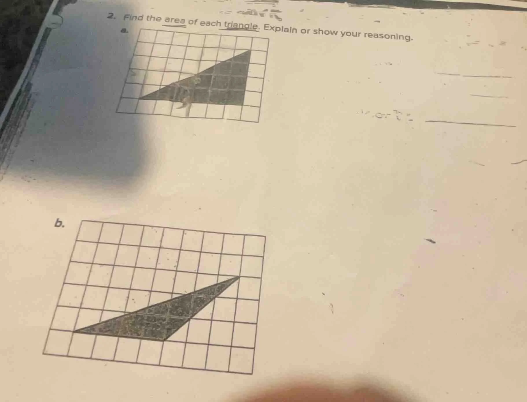 2. find the area of each triangle. explain or show your reasoning. a. b.