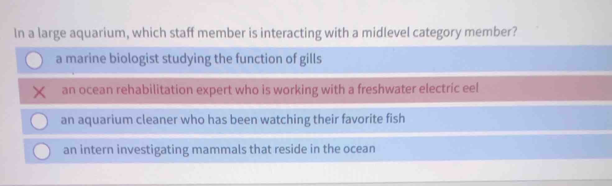 in a large aquarium, which staff member is interacting with a midlevel …