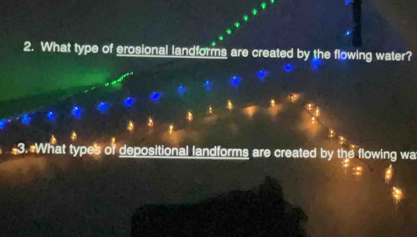 2. what type of erosional landforms are created by the flowing water? 3…