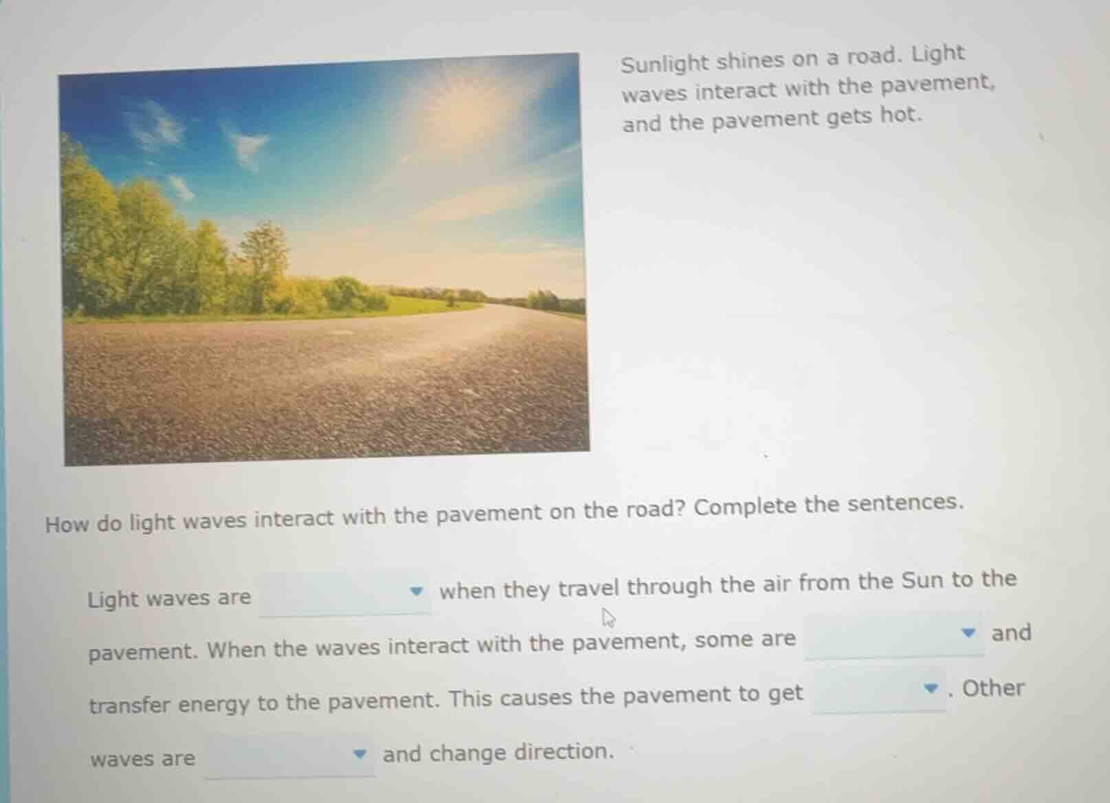 sunlight shines on a road. light waves interact with the pavement, and …