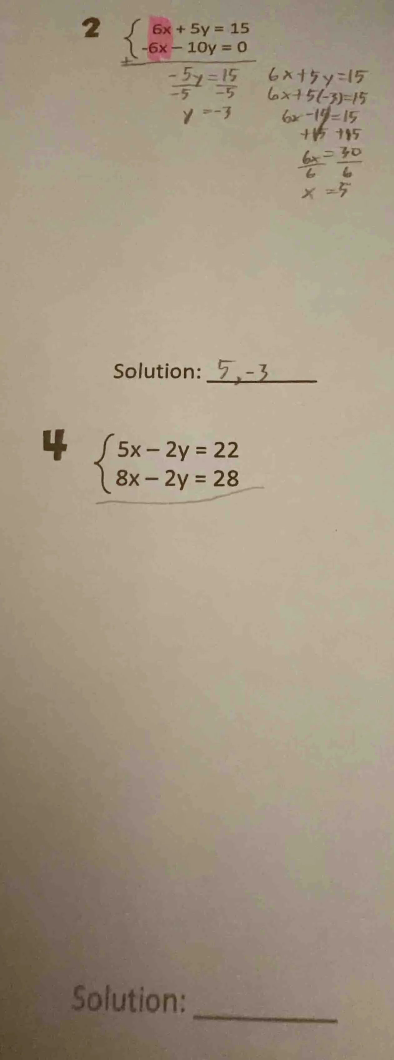 2 $\begin{cases} 6x + 5y = 15 \\ -6x - 10y = 0 end{cases}$$\frac{-5y}{-…