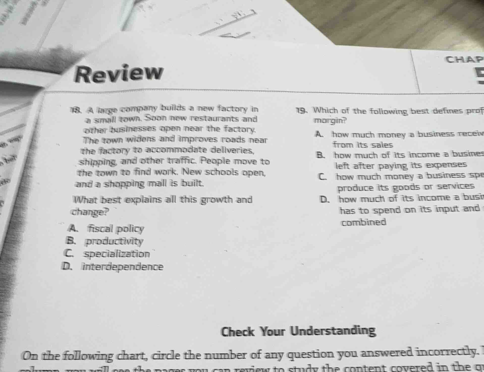 review 18. a large company builds a new factory in a small town. soon n…